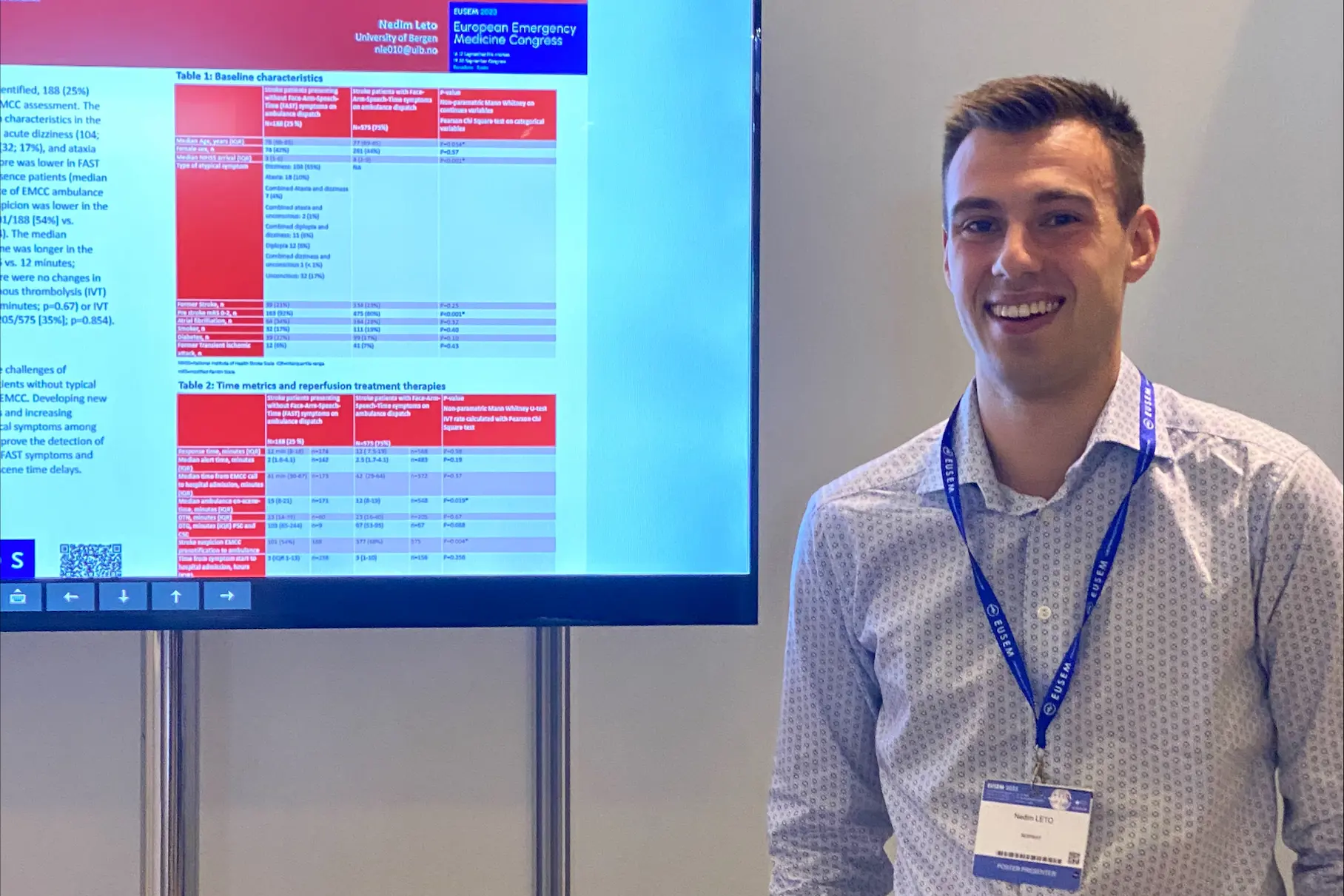 A man standing in front of a screen