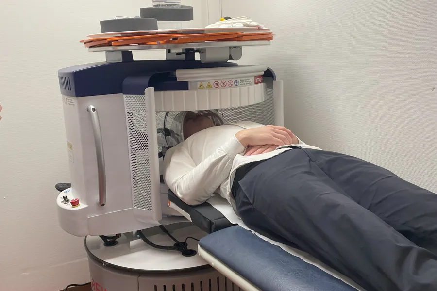 A person lying in a hospital bed