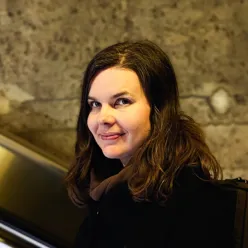 A woman smiling for the camera