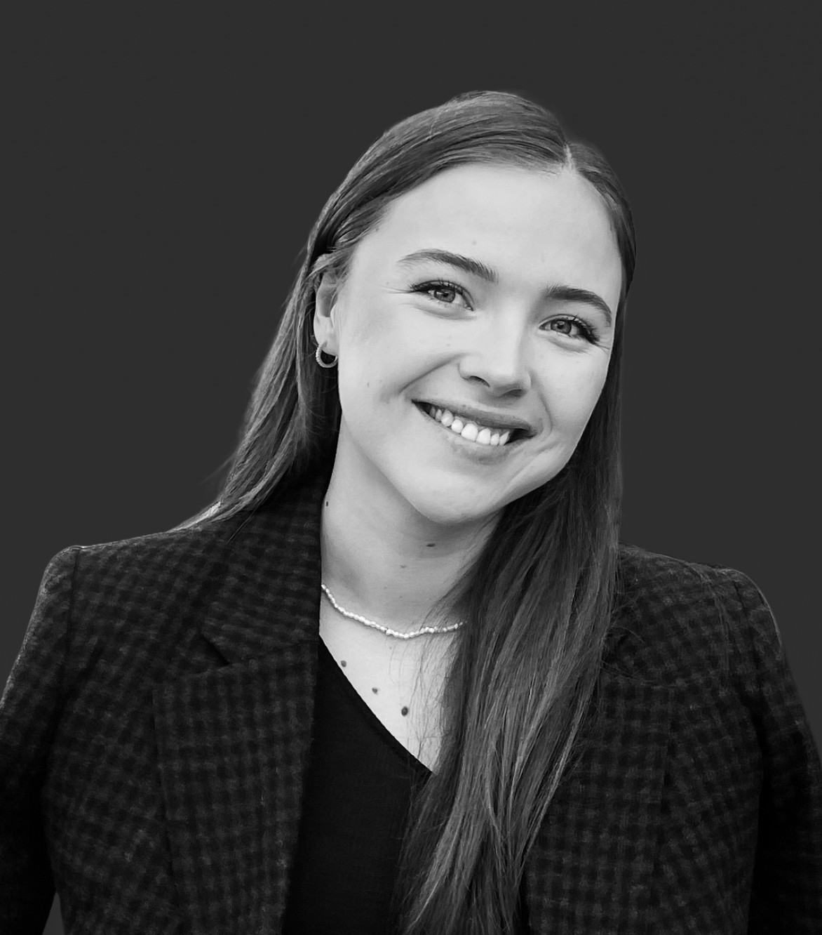 En person som smiler til kameraet