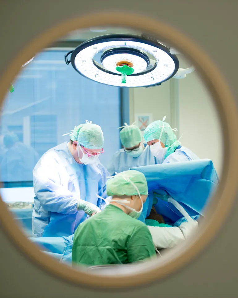 A group of surgeons in a room