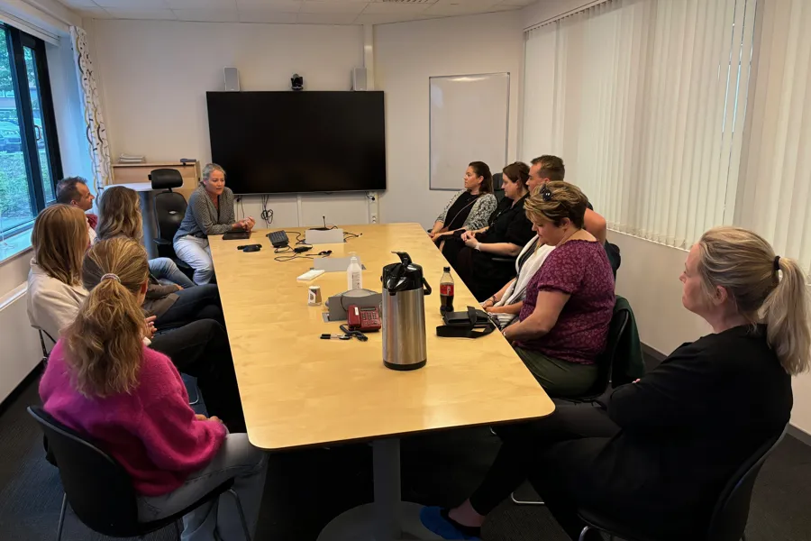 A group of people sitting around a table