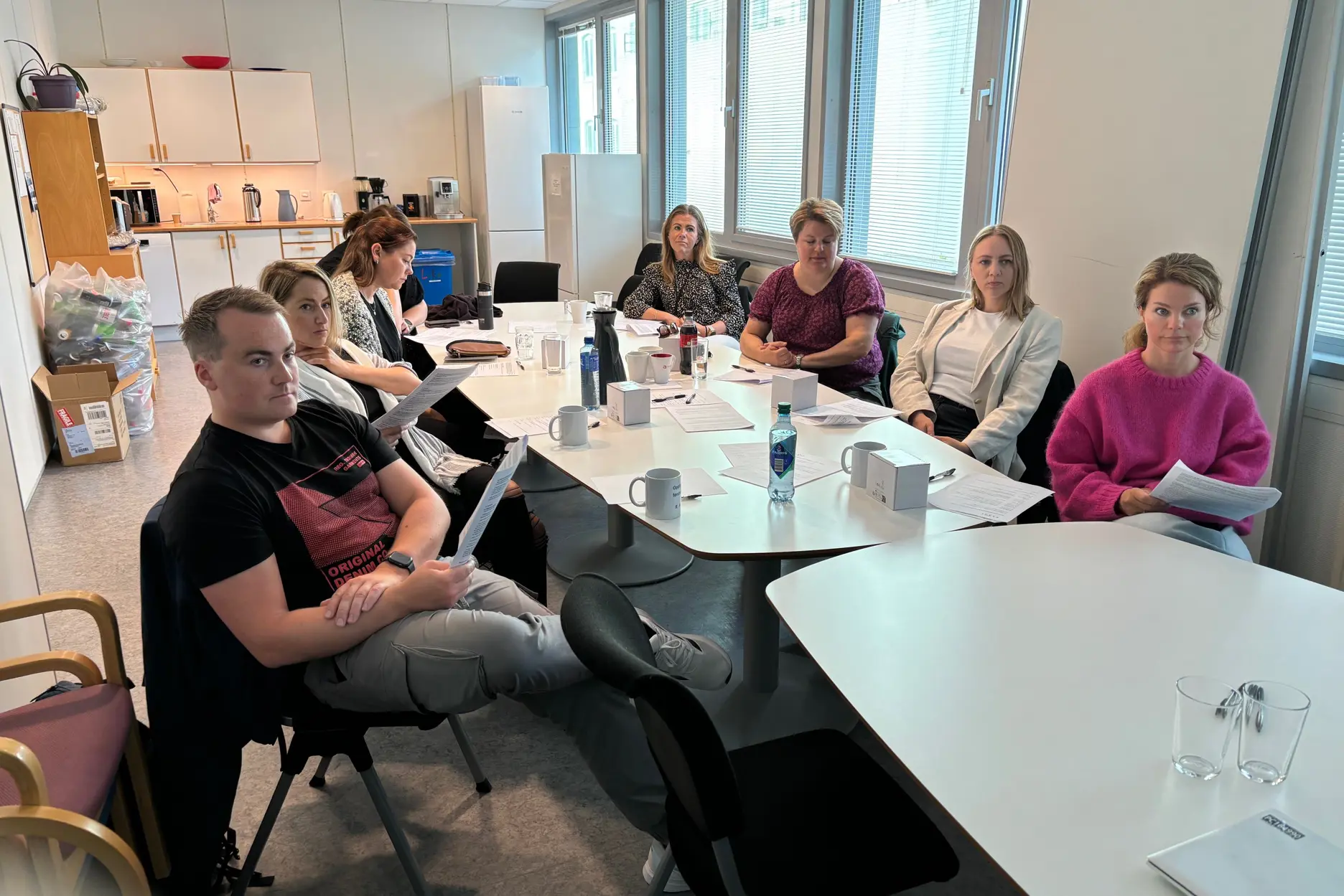 A group of people sitting around a table