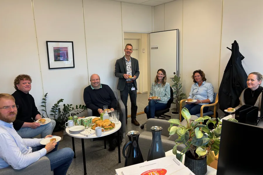 A group of people sitting in a room