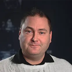 A man with a grey shirt