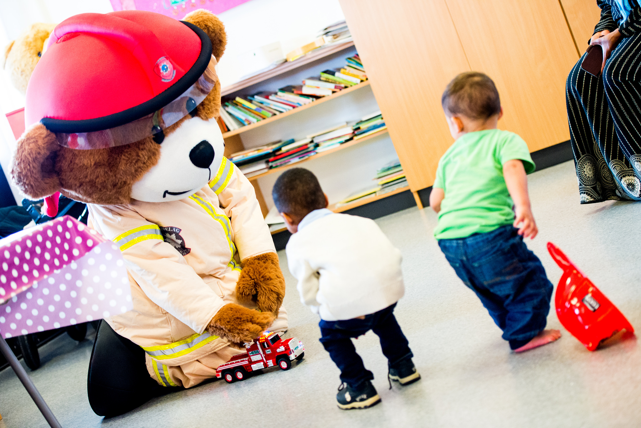 A person in a garment with kids