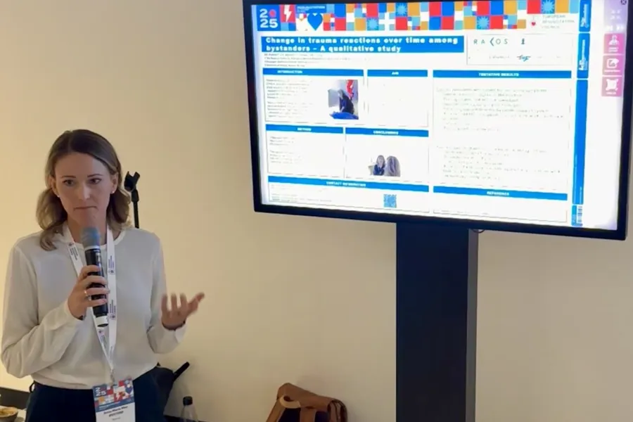 A man standing in front of a screen