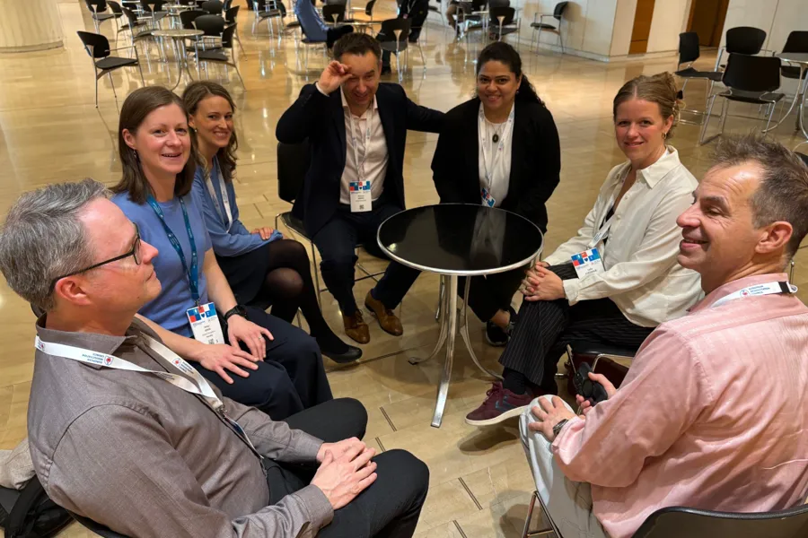 A group of people sitting in chairs