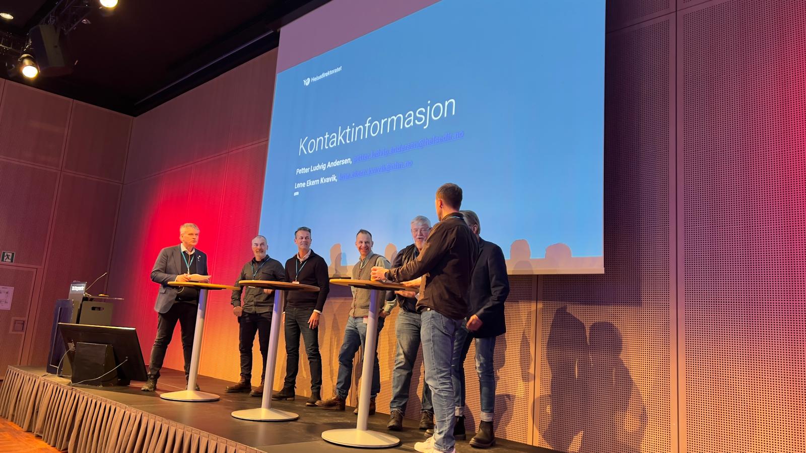 A group of men standing on a stage