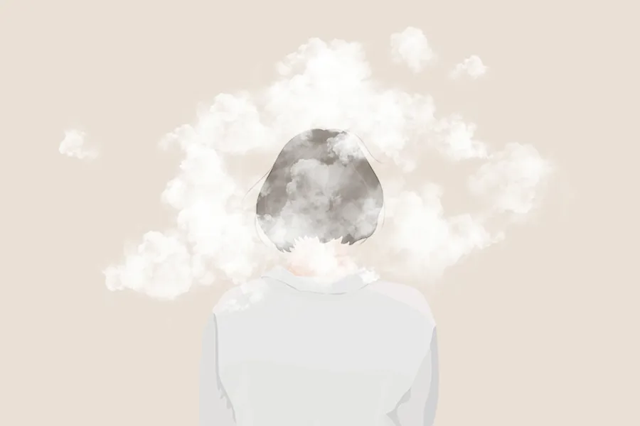 En person med røyk som kommer ut av munnen