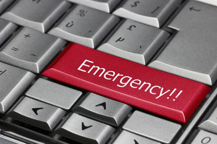 A red and white sticker on a keyboard