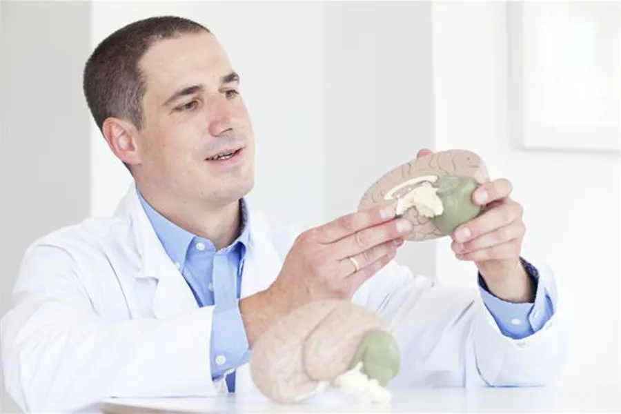 A doctor holding a baby